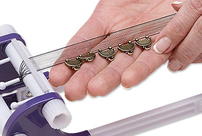 Charms on warp threads